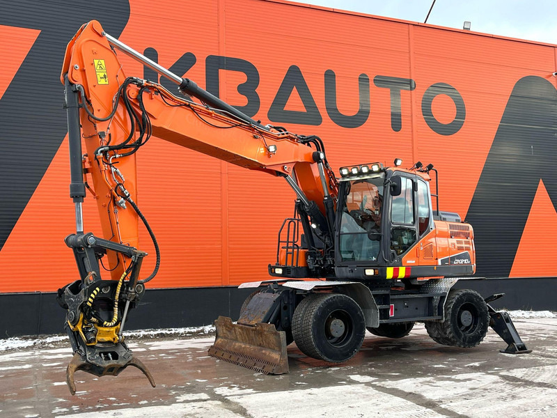 Doosan DX 210 W-5 ROTOTILT / AC / CENTRAL LUBRICATION / WEBASTO - Wheel excavator: picture 1 Doosan DX 210 W-5 ROTOTILT / AC / CENTRAL LUBRICATION / WEBASTO - Wheel excavator: picture 1