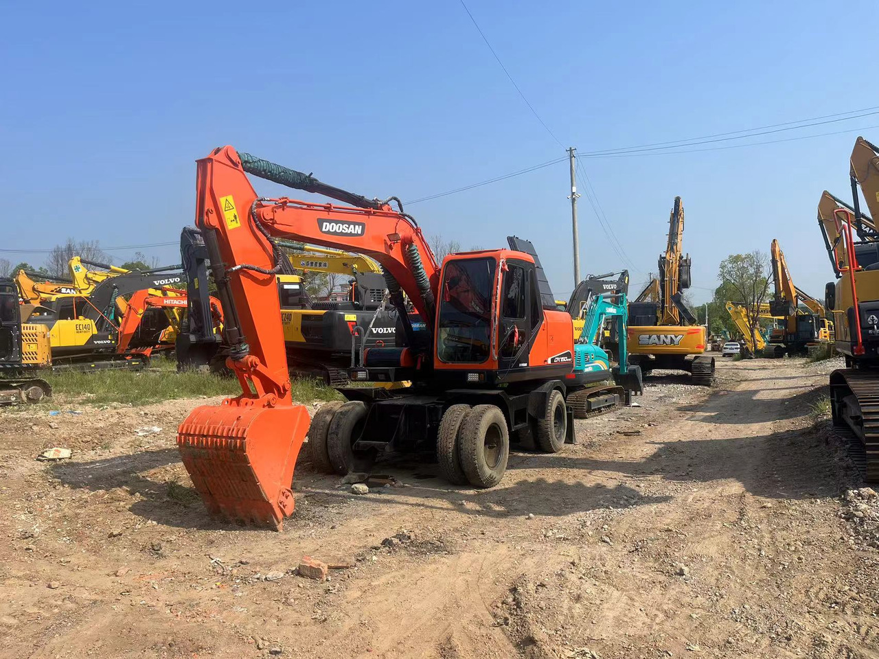 Doosan DX150W-9C - Wheel excavator: picture 1 Doosan DX150W-9C - Wheel excavator: picture 1