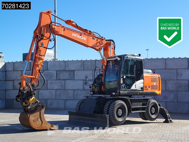 Hitachi ZX140W -5 OUTRIGGERS + BLADE - Wheel excavator: picture 1 Hitachi ZX140W -5 OUTRIGGERS + BLADE - Wheel excavator: picture 1