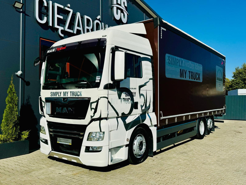 MAN TGX 26.420 - Curtainsider truck: picture 1 MAN TGX 26.420 - Curtainsider truck: picture 1